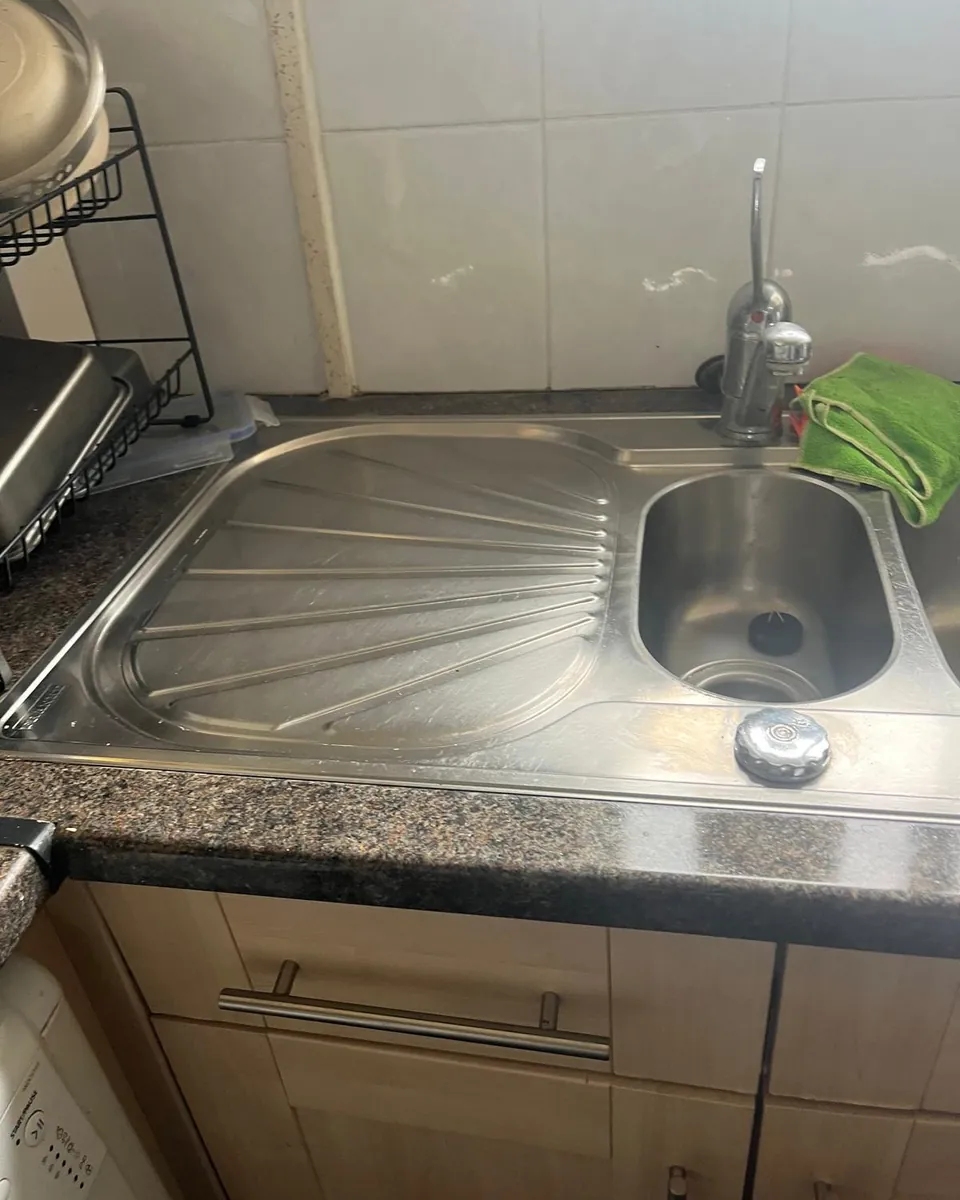 Kitchen sink and drainer after cleaning by Stay Flow Cleaners